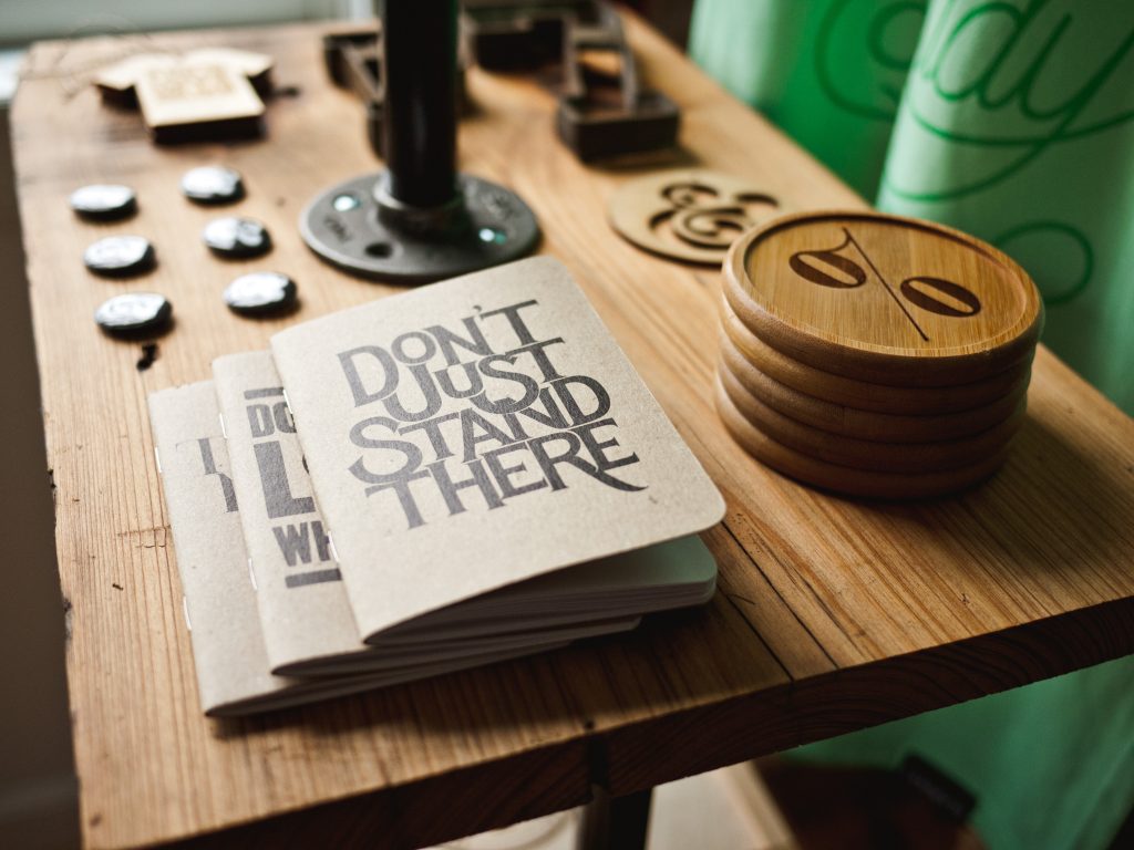 Notebooks and trinkets on a wood table